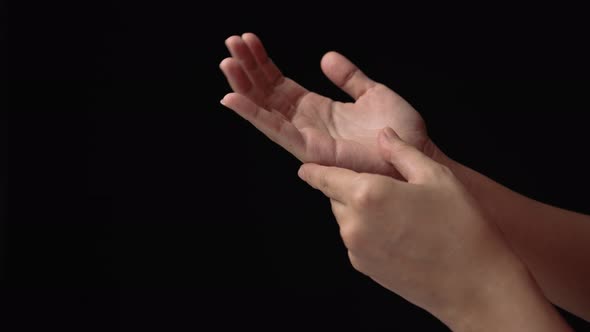 Close up of dry and cracked skin on a young woman hand.