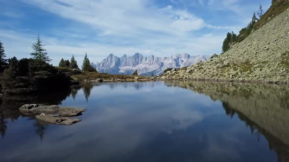 Aerial of Lake Spiegelsee with Reflections of Dachstein, Austria