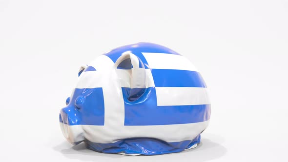 Deflating Inflatable Piggy Bank with Flag of Greece
