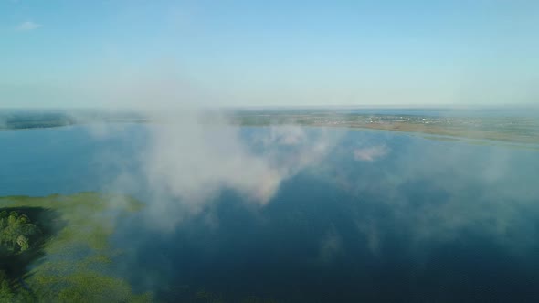 Flight in the Clouds Over the Island of Lake Svityaz