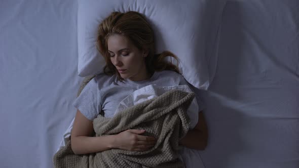 Beautiful Woman Sleeping Soundly in Her Comfortable Orthopedic Bed, Healthcare