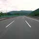 Fast Moving Over Modern Highway Three Traffic Lane Road Between Hills - VideoHive Item for Sale