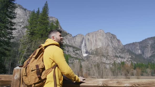 Young Bearded Man with Tourist Backpack Relaxing in the Yosemite Valley USA 6K