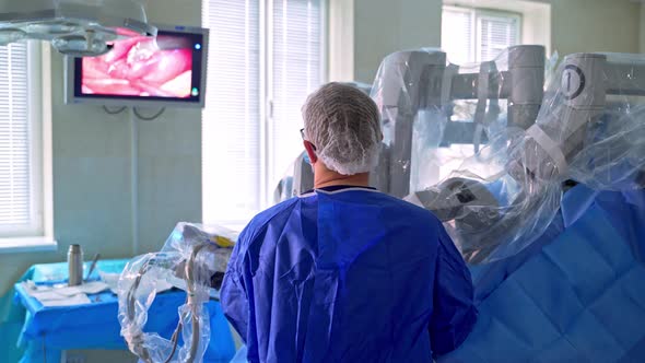 Doctor controls the robotic surgery