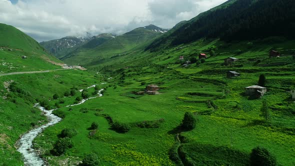 Aerial Valley Slope And Village