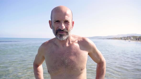 Slow motion shot of senior man at beach