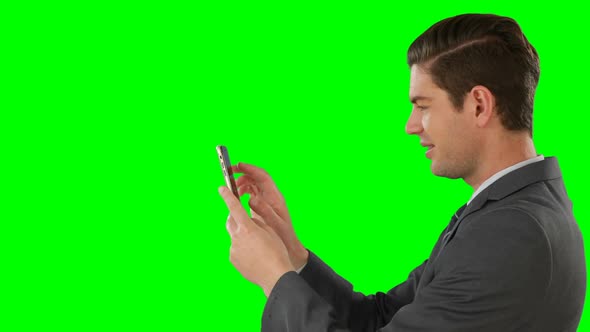 Side view of businessman using mobile phone