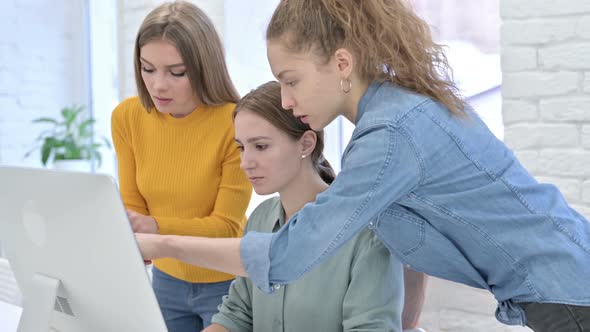 Creative Female Startup Team Working on Tablet and Desktop