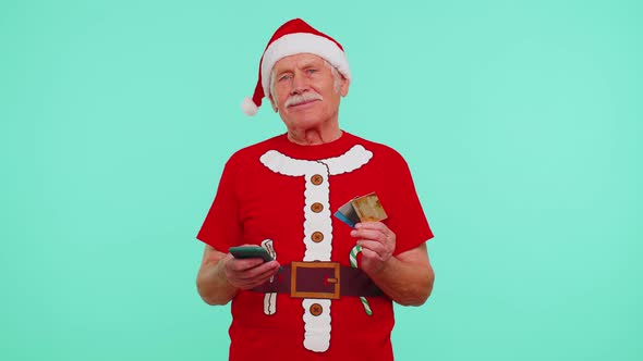 Christmas Grandfather Using Credit Bank Card Smartphone While Transferring Money Shopping Online