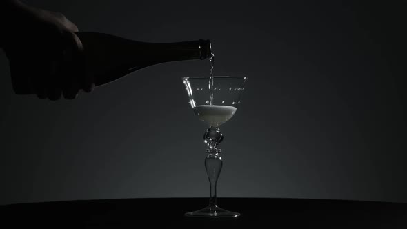 Champagne is Poured Into a Very Beautiful Glass