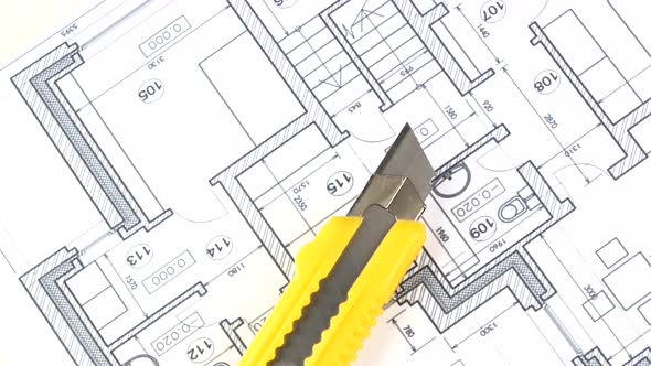 Yellow Stationery Knife on Building Plan, Rotation
