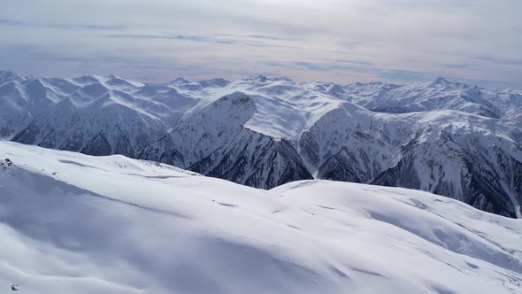 Winter drone flight over Mestia`s mountains in gerorgia. Tetnuldi Ski Resort next to Uschba and Tet