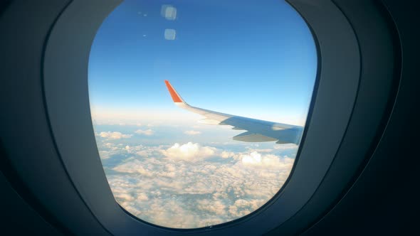 Plane's Wing at Sunset Shot Through Its Illuminator