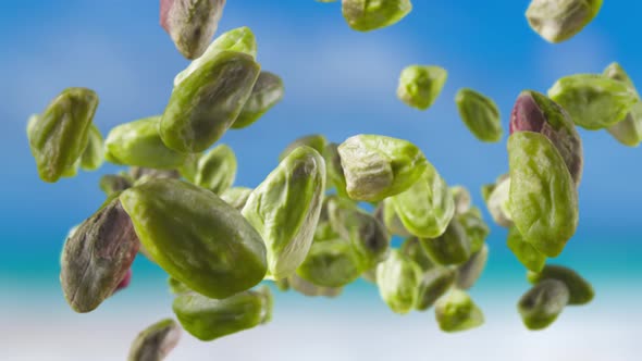 Flying of Peeled Pistachios in Sky Background