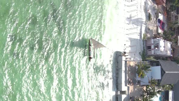 Vertical Video Boats in the Ocean Near the Coast of Zanzibar Tanzania Aerial View