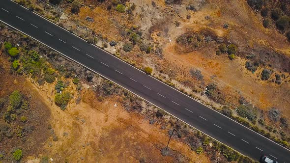Top View of a Car Rides Along a Desert Road on Tenerife Canary Islands Spain