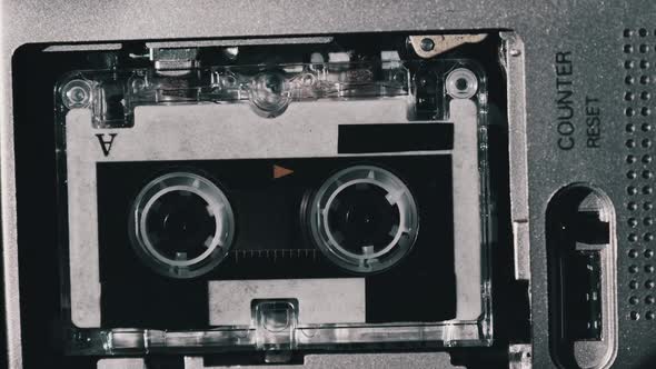 The Microcassette Spins in a Portable Handheld Recorder Tape Retro Player