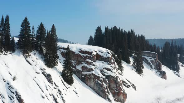 Aerial View of the Cliff with Trees in Winter
