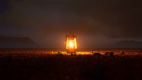 Old vintage lamp standing in the middle of desert surrounded by pebbles. 4KHD