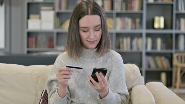 Portrait of Young Woman Making Online Payment on Smartphone