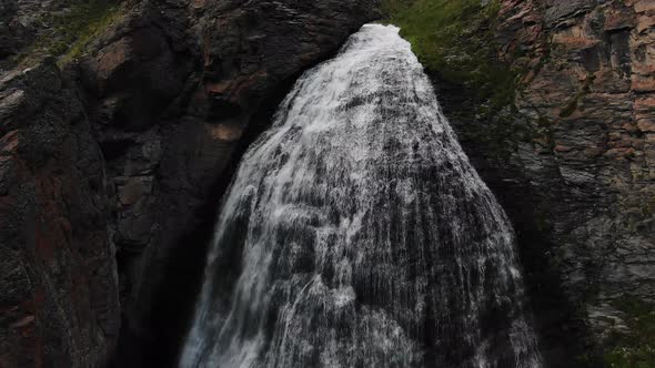 High Powerful Waterfall Streams Fall From Narrow Canyon