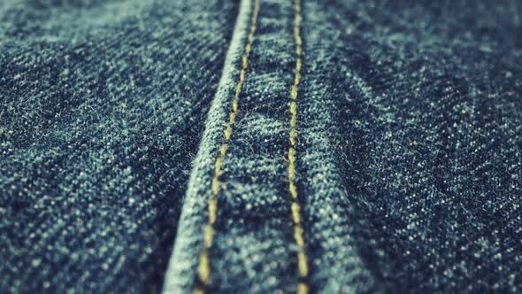 Extreme Detailed of Blue Denim Jeans Texture in Dolly Shot Over Cloth Surface