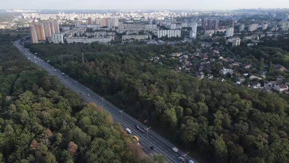 Megalopolis Next To the Forest: the Contact Between the Big City and Nature. Aerial View. Slow