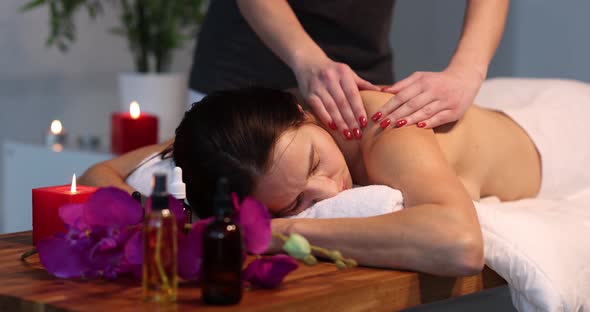 Young Woman Gets Professional Back Massage at Spa