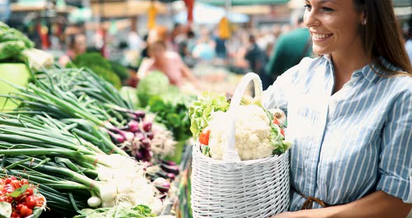 Portrait of Beautiful Woman Holding Shopping Basket