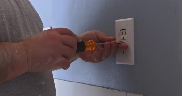 Removing Wall Outlet Cover in Order to Mask the Outlet in Preparation for Painting