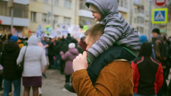 Single Father and Kid at Protest