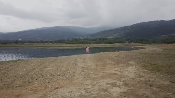 Young couple by the lake