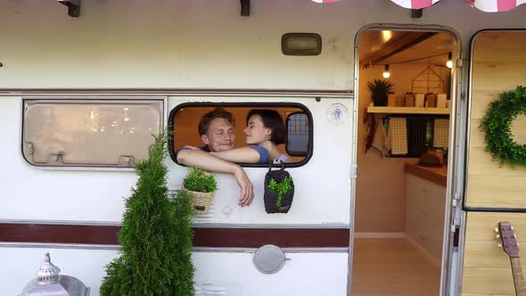 Happy Carefree Young People Enjoying Their Life in a Van