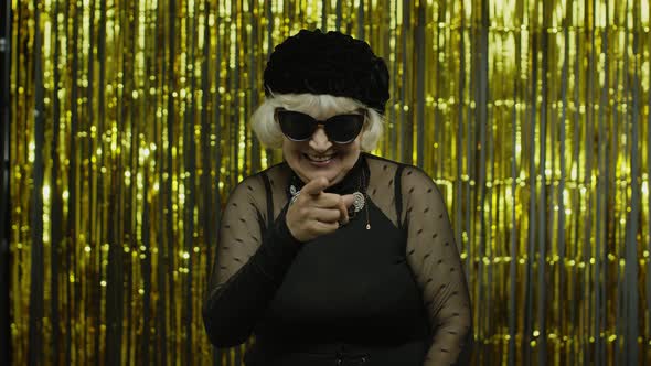 Senior Old Woman in Stylish Sunglasses Pointing Finger To Camera, Looking Happy, Choosing Person
