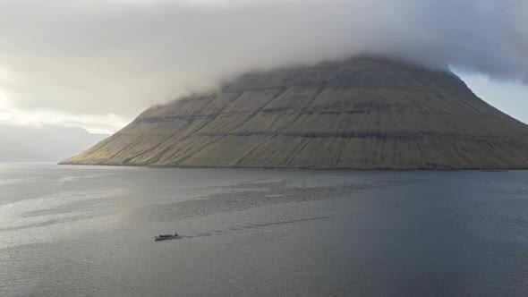 Drone Shot Of Ship And Faroe Island Mountain