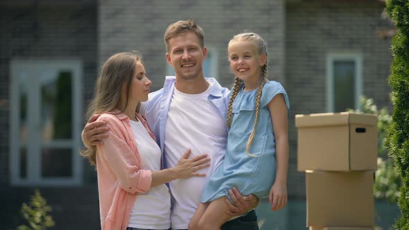 Wife and Daughter Kissing Happy Man, Moving in New Flat, Dreams Come True