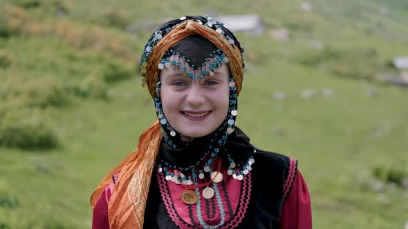 Girl In Traditional Dress Looking At Camera