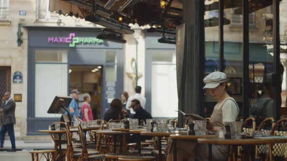 Waiter bringing food in a cafe