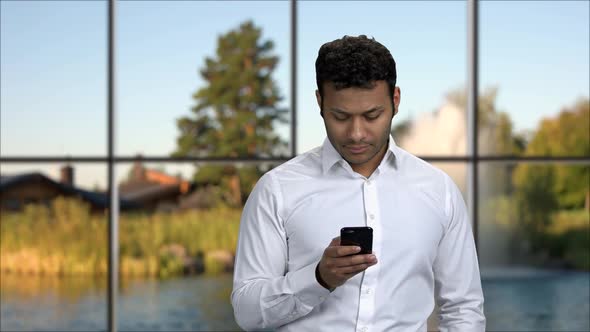 Portrait of Handsome Man Using Mobile Phone