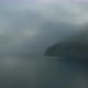 Aerial shoot. drone flies thought the fog over the lake on sunrise - VideoHive Item for Sale