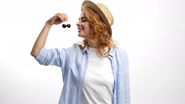 Nice Smell of Fresh Ripe Sweet Cherry Happy Woman in Straw Summer Hat Biting Berry Healthy Eating