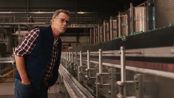 Male worker working at bottling plant