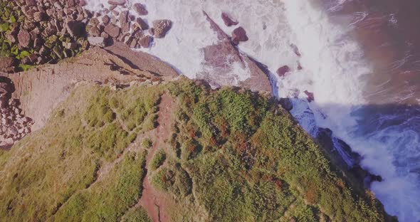 Drone view of a cliff and seascape in Bolao, Spain