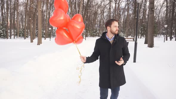 Man Stands on the Street and Waits for His Beloved Woman on a Date