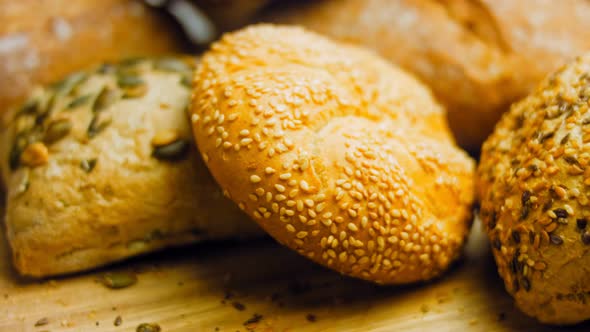 Different Kinds of Fresh Bread on Wooden Table