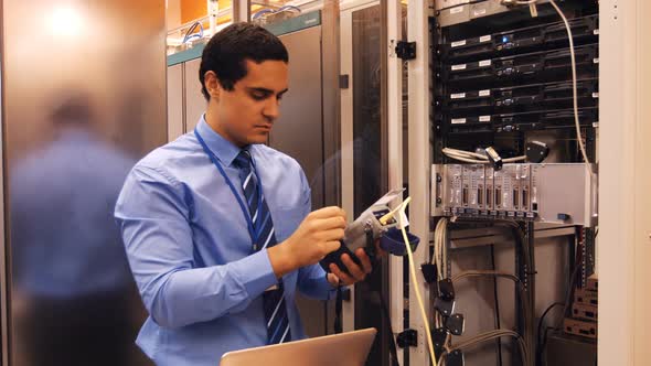 Technician using digital cable analyzer