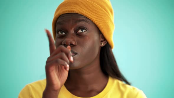 Cheerful African woman thinking about something