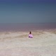 Woman in Flying Dress on Pink Salt Lake - VideoHive Item for Sale