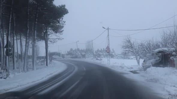 Driving On Rural Road In Heavy Snowfall In Anatolian Side Of Istanbul In Turkey. slow motion, wide s