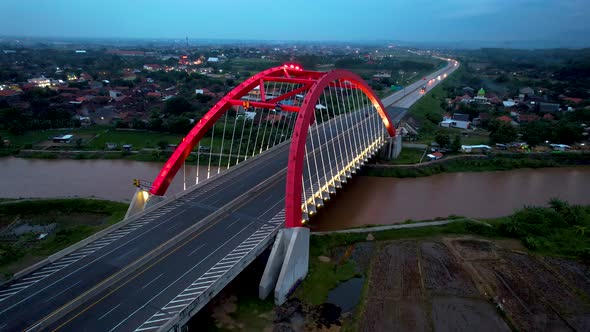 Aerial view of the Kalikuto Bridge, an Iconic Red Bridge at Trans Java Toll Road